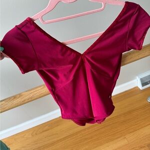 Yumiko short sleeve leo. Size large.